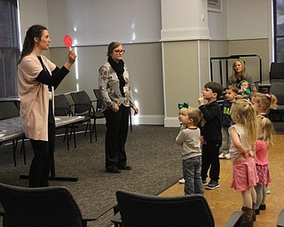 Neighbors | Abby Slanker.Megan Rankin, Poland library youth librarian (left) and Lauren Ellis, Canfield library youth librarian, led a group of children in playing Red Light, Green Light at the Canfield library’s Gotta Move Story Time on March 13.