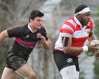 William D. Lewis The vindicator  Chaney's MyTwan Cottie(7) eludes a Canton defender during 4-12-19 action at Chaney.