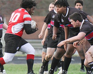 William D. Lewis The vindicator  Chaney's Elijah Smith10) heads into a swarm of Conton defenders during 4-12-19 action at Chaney.