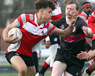 William D. Lewis The vindicator  Chaney's Christian Jones(12) eludes a Canton defender during 4-12-19 action at Chaney.