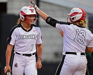 YOUNGSTOWN, OHIO - APRIL 12, 2019: Youngstown State's Grace Cea, left, is congratulated by Nikki Saibene after scoring a run on a RBI-single by Alex DeLeon in the third inning of their game, Friday night against Cleveland State at the Youngstown State softball complex. Youngstown State won 3-0. DAVID DERMER | THE VINDICATOR