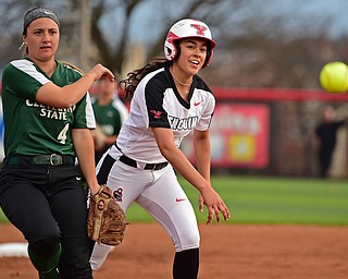 YOUNGSTOWN, OHIO - APRIL 12, 2019: Youngstown State's Yazmine Romero is forced out at third base as Cleveland State's Hallie Ward throws it to third in the first inning of their game, Friday night at the Youngstown State softball complex. Youngstown State won 3-0. DAVID DERMER | THE VINDICATOR
