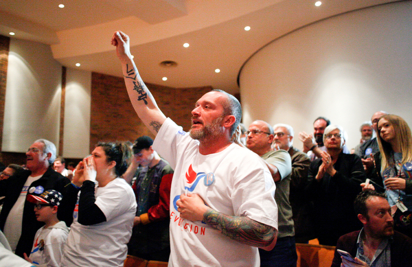 Chuck Denison, of Lake Milton, cheers with others as they listen to Sen. Bernie Sanders speak during the union town hall at Lordstown High School Sunday afternoon. EMILY MATTHEWS | THE VINDICATOR