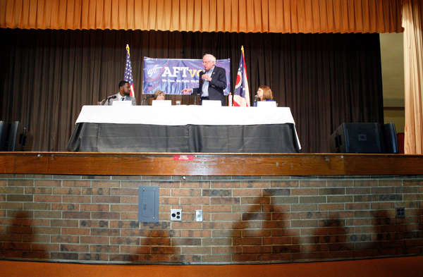 The shadows of crowd members are outlined as Sen. Bernie Sanders speaks during the union town hall at Lordstown High School Sunday afternoon. EMILY MATTHEWS | THE VINDICATOR