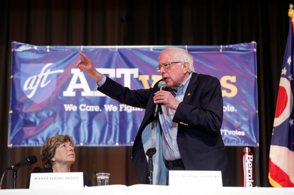 Sen. Bernie Sanders speaks while Randi Weingarten sits next to him during the union town hall at Lordstown High School Sunday afternoon. EMILY MATTHEWS | THE VINDICATOR