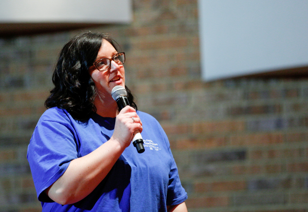 Alyssa Brookbank, the president of the Lordstown Teachers Association, asks Sen. Bernie Sanders a question during the union town hall at Lordstown High School Sunday afternoon. EMILY MATTHEWS | THE VINDICATOR