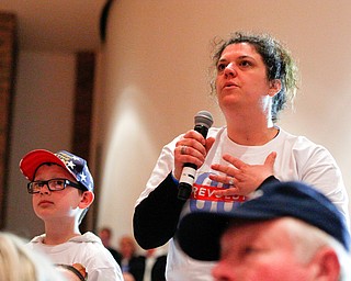 Katie Fallo, of Niles, asks Sen. Bernie Sanders a question with her son Ben Delong, 8, next to her during the union town hall at Lordstown High School Sunday afternoon. EMILY MATTHEWS | THE VINDICATOR