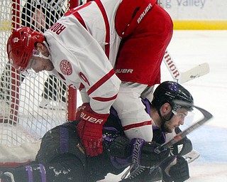 William D. Lewis The Vindicator Phantoms Daltn Messina(14) and ) moves the puck past Dubuque's Luke Robinson(9) get tangled up during 4-15-19 action in Youngstown.