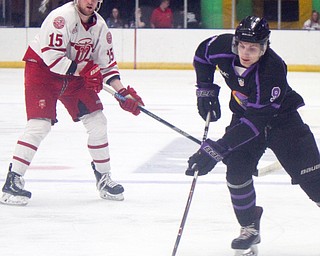 William D. Lewis The Vindicator Phantoms Matt DeMelis(9) moves the puck past Dubuque's Cooper Haar(15) during 4-15-19 action in Youngstown.