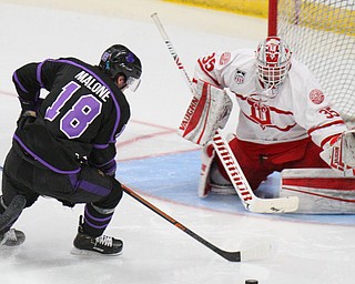 William D. Lewis The Vindicator Phantoms Jack Malone (18)lines up a shot  Dubuque's Matthew Thiessen (35) during 4-15-19 action in Youngstown.