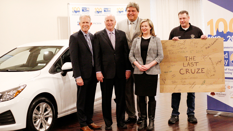 Greg Greenwood, left, of Greenwood Chevrolet, Austintown, Bob Hannon, president of United Way of Youngstown and Mahoning County, businessman Ed Muransky, Alexa Sweeney of Sweeney Chevrolet of Boardman, and Dave Green, president of United Auto Workers Local 1112, stand with the final Lordstown-built Chevrolet Cruze. Muransky bought the car and will put it on the auction block as a fundraiser for the United Way.