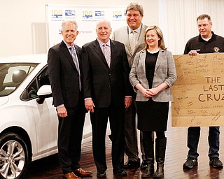 Greg Greenwood, left, of Greenwood Chevrolet, Austintown, Bob Hannon, president of United Way of Youngstown and Mahoning County, businessman Ed Muransky, Alexa Sweeney of Sweeney Chevrolet of Boardman, and Dave Green, president of United Auto Workers Local 1112, stand with the final Lordstown-built Chevrolet Cruze. Muransky bought the car and will put it on the auction block as a fundraiser for the United Way.