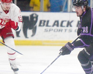 Brett Murray, right, of the Youngstown Phantoms scores the home team's lone goal Monday night at the Covelli Centre. Trying to stop him was Cooper Haar of the Dubuque Fighting Saints. Dubuque won 3-1 in the best-of-three quarterfinal series in the USHL's Clark Cup Playoffs.