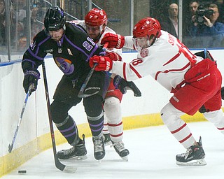 William D. Lewis The Vindicator Phantoms Brett Murray(21) keeps  the puck fromDubuque's Jacob Semik(7) and Patrick Smyth(18) during 4-15-19 action in Youngstown.