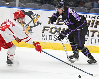 William D. Lewis The Vindicator Phantoms Brett Murray (21) and Dubuque's JD Greenway(24)during 4-16-19 playoff game.