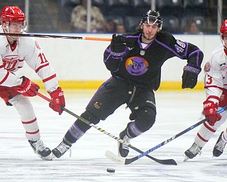 William D. Lewis The Vindicator Phantoms Joey Abate(45) moves the puck between Dubuque'sVerners Egle(11) and Logan Pietla(11) during 4-16-19 playoff game.