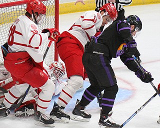 William D. Lewis The vindicator PhantomsDalton Messina14) goes for the puck past Dubuque'sJD Greenway(14) and Patrick Smyth(18) during 4-16-19 playoff game .