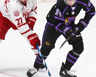 William D. Lewis The Vindicator Phantoms Steve Holtz924) and Dubuque's Willie Knierim(27)  during 4-16-19 playoff game.