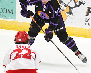 William D. Lewis The Vindicator Phantoms Gianfrancio Cassaro(23) moves the puck around Dubuque's Reise Garber(22)) blocks a shot during 4-16-19 playoff game.