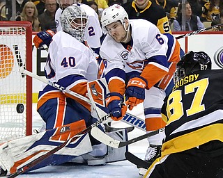 Pittsburgh Penguins Sidney Crosby (87) can't get a shot past New York Islanders goaltender Robin Lehner (40) with Ryan Pulock (6) defending during the second period in Game 4 of an NHL hockey first-round playoff series in Pittsburgh. The Islanders won 3-1 to complete the sweep of the Penguins in the first round of the Stanley Cup Playoffs.
