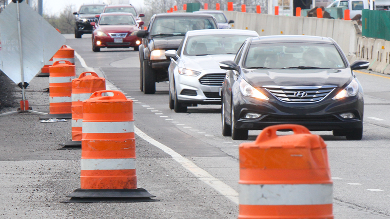 Motorists pass through a construction zone along Interstate 680 between Belle Vista Avenue and State Route 711 Tuesday. The familiar orange barrels and concrete dividers are up as Ohio Department of Transportation and Mahoning County Engineer Office crews make various road improvements.