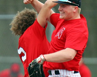 William D. Lewis The Vindicator Niles' David Mays(33) gets congrats from Seth McMillion(5) after catching a flyball to seal a 4-1 win of Poland 4-17-19.