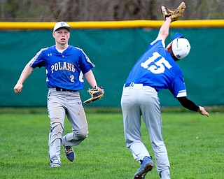 William D. Lewis The Vindicator Poland's Mason McCurdy(15) hauls in  a flyball while Alex Barth(2) cover during  a game 4-17-19 at Niles.