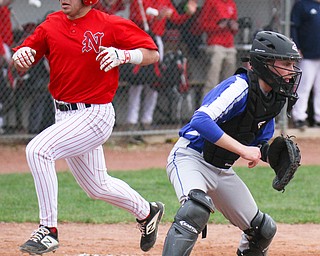 William D. Lewis The Vindicator Niles' Joe Gallo(17) scores during 1rst inning of 4-17-19 game at Niles.Wfor the throw is Poland's Andrew Testa(11).