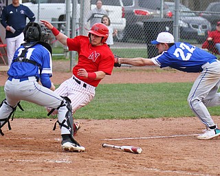 William D. Lewis The Vindicator Niles' Nick Guarnieri(7) is out at home during 4-17-19 game at Niles. making the tag for Poland is Braden Olsen(22) at the plate is Andrew Testa(11).