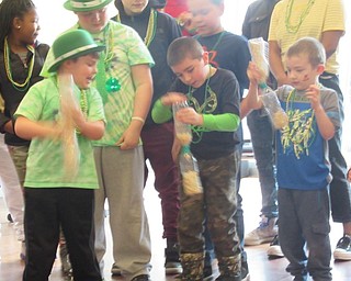 Neighbors | Jessica Harker.Children competed for books and small toys on March 16 at the Michael Kusalaba library Green Party.