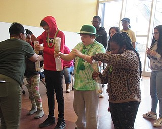 Neighbors | Jessica Harker.Community members competed to see who could get the most Lucky Charms from the top bottle to the bottom fastest on March 16 at the Michael Kusalaba library.