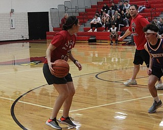 Neighbors | Abby Slanker.Canfield High School staff member Kristen Gennaro looked to pass the ball during the students versus staff basketball game, which National Honor Society members Luke Pallante and Svetha Nallapaneni organized as their service project on March 21.