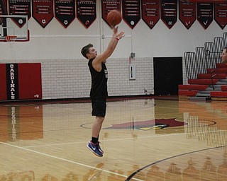 Neighbors | Abby Slanker.Canfield High School senior Jake Pitzer took a shot during the students versus staff basketball game, which benefitted Operation Blessing on March 21.