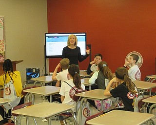 Neighbors | Jessica Harker .Middle school students learned about poetry in an English class at Mooney high school on March 29 for the school's fifth- and sixth-grade day.