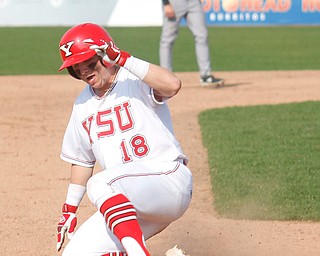 YSU's Drew Dickerson slides into third during their second game against NKU on Thursday. EMILY MATTHEWS | THE VINDICATOR