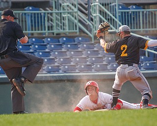 YSU's Lucas Nasonti gets called out at third after NKU's Andrew Bacon tags him out on a slide during their second game on Thursday. EMILY MATTHEWS | THE VINDICATOR