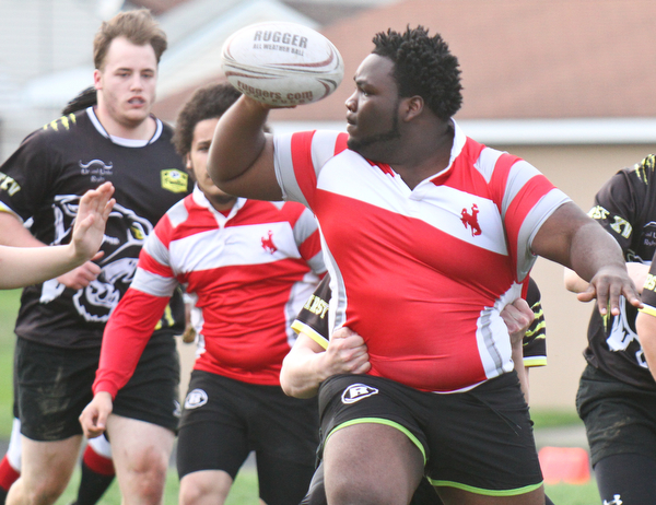William D. Lewis The vindicator Shawn Rollins(23) looks to pass during 4-18-19 action with Massilon Perry.