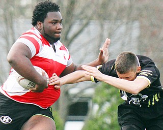 William D. Lewis  The Vindicator Chaney's Shawn Rollins(23) eludes  a Massilon defender.