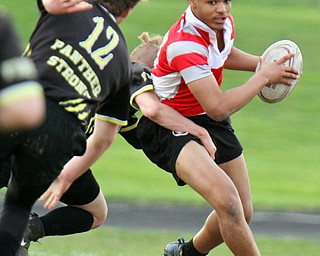 William D. Lewis The vindicator Chaney's Rashawn Perkins(15) eludes Massiloin'sJakob Doyle(12) during 4-18-19 action at Chaney.