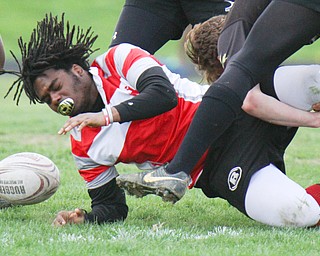 William D. Lewis The Vindicator Chaney'sElijah Smith(10) loses control of the ball after being hit by a Massilon defender.