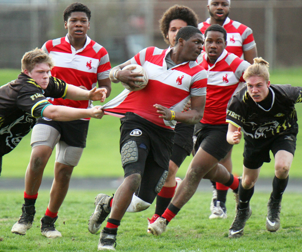 William D. Lewis the vindicator Cjaney's JR Tellington(10) eludes Massilon defendes during 4-18-19 game.