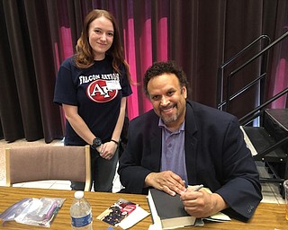 Neighbors | Submitted.Austintown twelfth-grader Stephanie Mulligan posed with author Neal Shusterman as he signed books for students who attended YSU's annual English Festival where Shusterman spoke as the guest author.