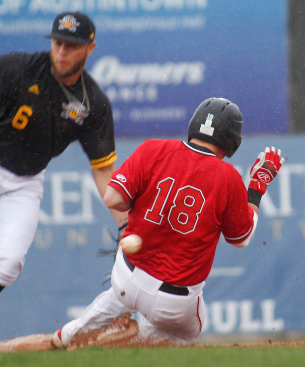 YSU's Drew Dickerson slides safely into second as NKU's Collin Luty misses the throw from home during their game against NKU at Eastwood Field on Friday. EMILY MATTHEWS | THE VINDICATOR