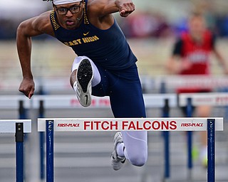 AUSTINTOWN, OHIO - APRIL 20, 2019: East's Tobias Hayes clears a hurdle during the boys 110 meter hurdles during the Mahoning County Track & Field Championship Meet at Austintown Fitch High School. DAVID DERMER | THE VINDICATOR