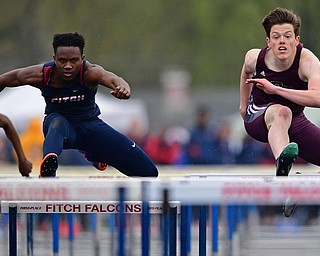 AUSTINTOWN, OHIO - APRIL 20, 2019: Boardman's Brian Yauger, right, and Fitch's Reggie Floyd clear hurdles during the boys 110 meter hurdles during the Mahoning County Track & Field Championship Meet at Austintown Fitch High School. DAVID DERMER | THE VINDICATOR