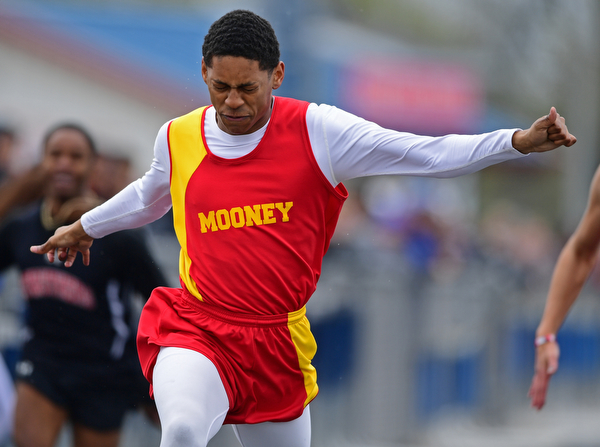 AUSTINTOWN, OHIO - APRIL 20, 2019: Mooney's Shamar Brooks crosses the finish line during the boys 100 meter dash during the Mahoning County Track & Field Championship Meet at Austintown Fitch High School. DAVID DERMER | THE VINDICATOR