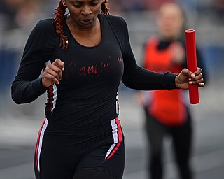 AUSTINTOWN, OHIO - APRIL 20, 2019: Campbell's Kaleecia Addison crosses the finish line to win the girls 4x200 meter relay during the Mahoning County Track & Field Championship Meet at Austintown Fitch High School. DAVID DERMER | THE VINDICATOR