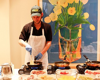 Zeke Pedrick, with Kravitz Deli, prepares omelettes at the annual Easter Brunch at Fellows Riverside Gardens on Sunday. EMILY MATTHEWS | THE VINDICATOR