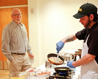 Zeke Pedrick, right, with Kravitz Deli, prepares an omelette for Ed Medved, of Warren, at the annual Easter Brunch at Fellows Riverside Gardens on Sunday. EMILY MATTHEWS | THE VINDICATOR