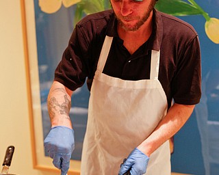 Zeke Pedrick, with Kravitz Deli, prepares omelettes at the annual Easter Brunch at Fellows Riverside Gardens on Sunday. EMILY MATTHEWS | THE VINDICATOR